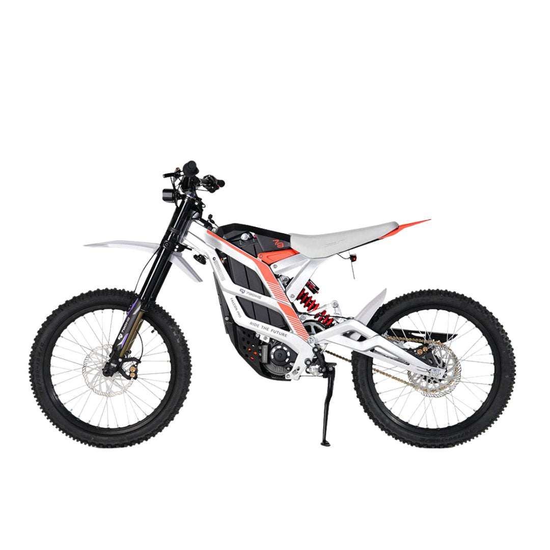 The 79Bike Falcon Pro, a 72V electric dirt bike by 79Bike, showcases a sleek white and black frame with knobby tires and an elevated seat. It features front and rear suspension, disc brakes, and minimal graphics on a plain white backdrop.
