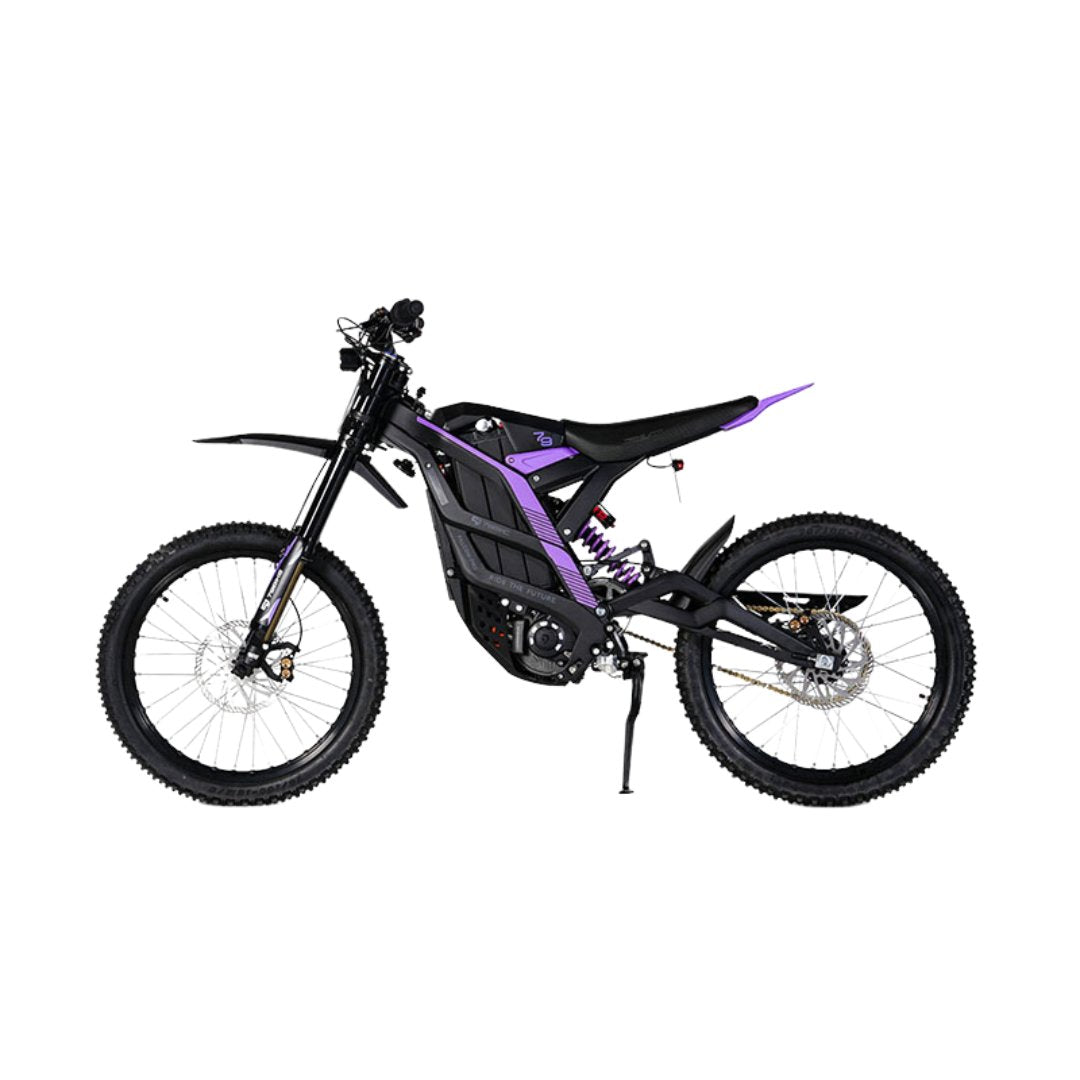 The 79Bike Falcon Pro, a 72V electric dirt bike, showcases a black frame with purple accents. It features off-road tires, front and rear suspension, and a minimalist seat. Displayed in side profile on a white background.