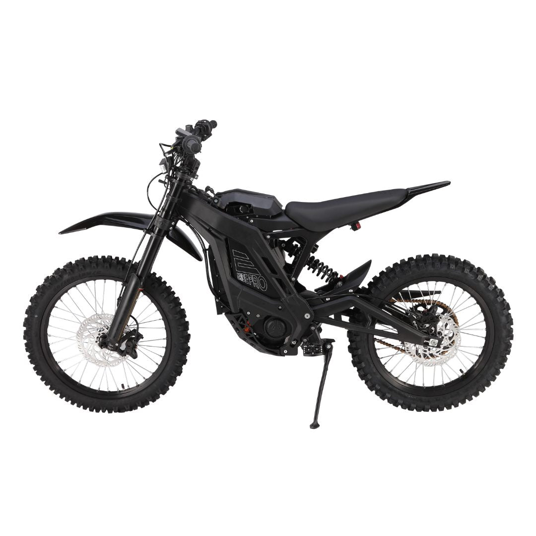 The E Ride Pro SR by E-Ride Pro is a sleek black electric dirt bike with advanced front and rear suspension, thick knobby tires, and disc brakes. Its minimalist design complements the compact frame as it stands on its kickstand against a white backdrop, ready for adventure.