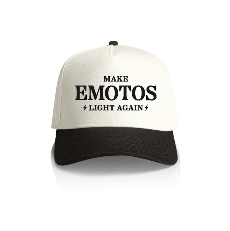 The Amped Bikes MELA HAT is a white and black snapback featuring MAKE EMOTOS LIGHT AGAIN in bold black letters on the front—white crown, black bill—ideal for E-Moto fans.