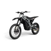The Razor Stage2 M2 72V Electric Dirt Bike features a sleek black design with knobby tires, a robust frame, and swappable lithium battery. Its minimalist body with angular lines and unique front fender offers style and function for off-road terrains at speeds up to 65 MPH.