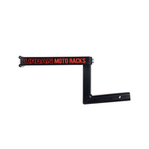 The sleek black steel rack from Amped Bikes, emblazoned with Urban Moto Racks in bold red text, offers a versatile hinged design for easy attachment and support, ideal for both traditional and electric moto enthusiasts.