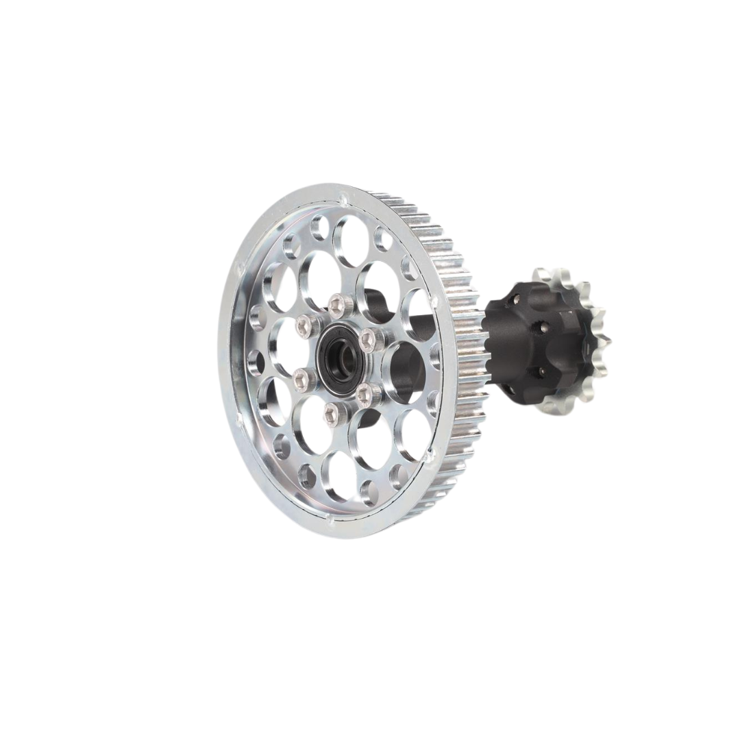 A detailed image of a silver gear with circular cutouts from the Amped Bikes E Ride Pro Jackshaft Assembly, featuring evenly spaced holes, a central hub, and an attached toothed smaller gear on a plain white background.