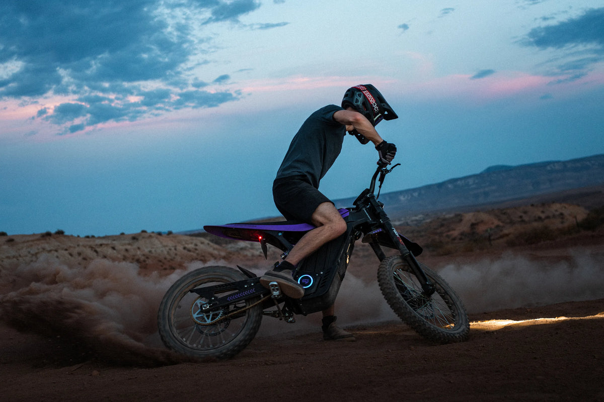 79Bike Lynx rider throwing a whip over desert terrain