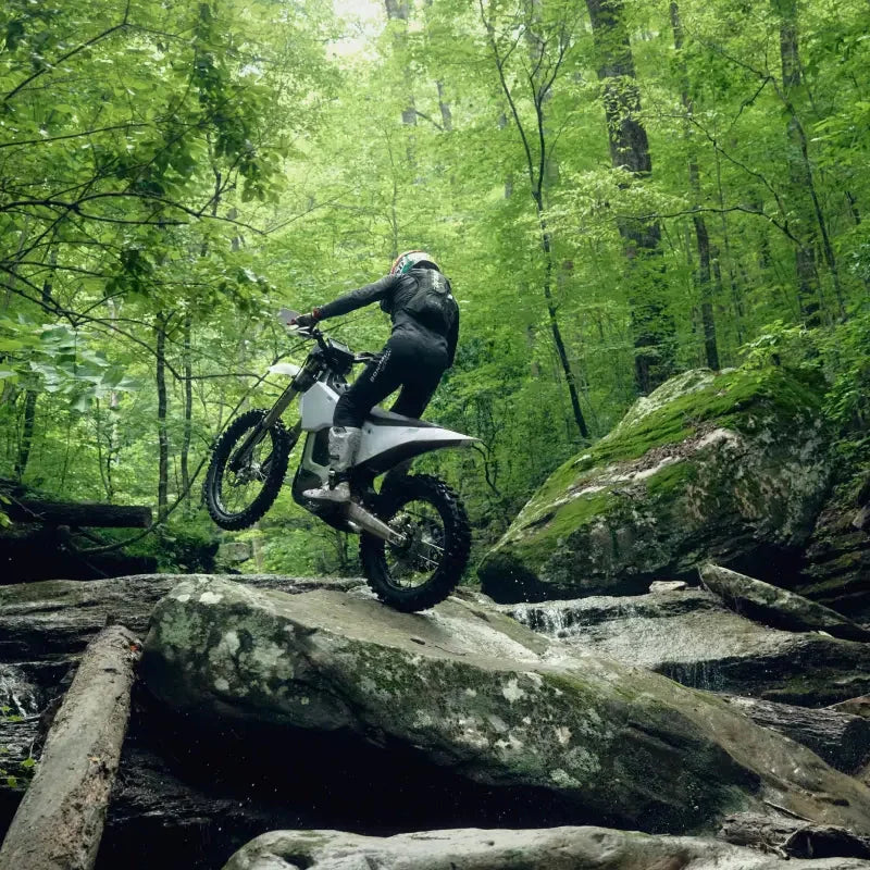 Bonnell 805 RX hard-enduro riding through a forest rock garden
