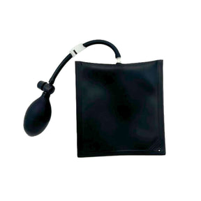 The Amped Bikes Air Wedge Bag Pump Leveling and Alignment Tool is a black, fiber-reinforced TPU inflatable shim with a hand bulb and tube for lifting or separating objects, shown on a white background.