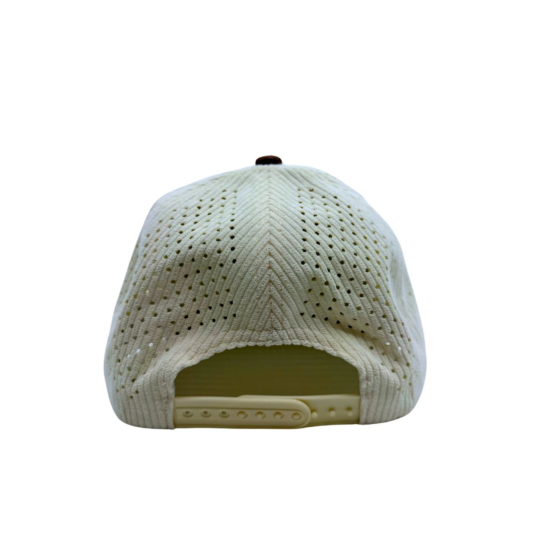 Back end of the cap with the snap fittings and off-white corduroy mesh.