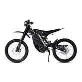 The 79Bike Falcon Pro, a 72V electric dirt bike from 79Bike, features off-road tires, a slim black frame, front and rear suspension, and a side stand—built for agility and control. Shown from the left against a white background.