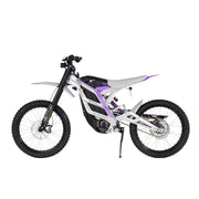 The 79Bike Falcon Pro is a 72V electric dirt bike with a sleek white and black design accented in purple, large off-road tires, and a minimalist frame.
