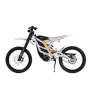 The 79Bike Falcon Pro, a 72V electric dirt bike by 79Bike, boasts a sleek white and gray frame with black tires and yellow accents. It features a minimalist design with visible suspension components and off-road capabilities, showcased against a plain white background.