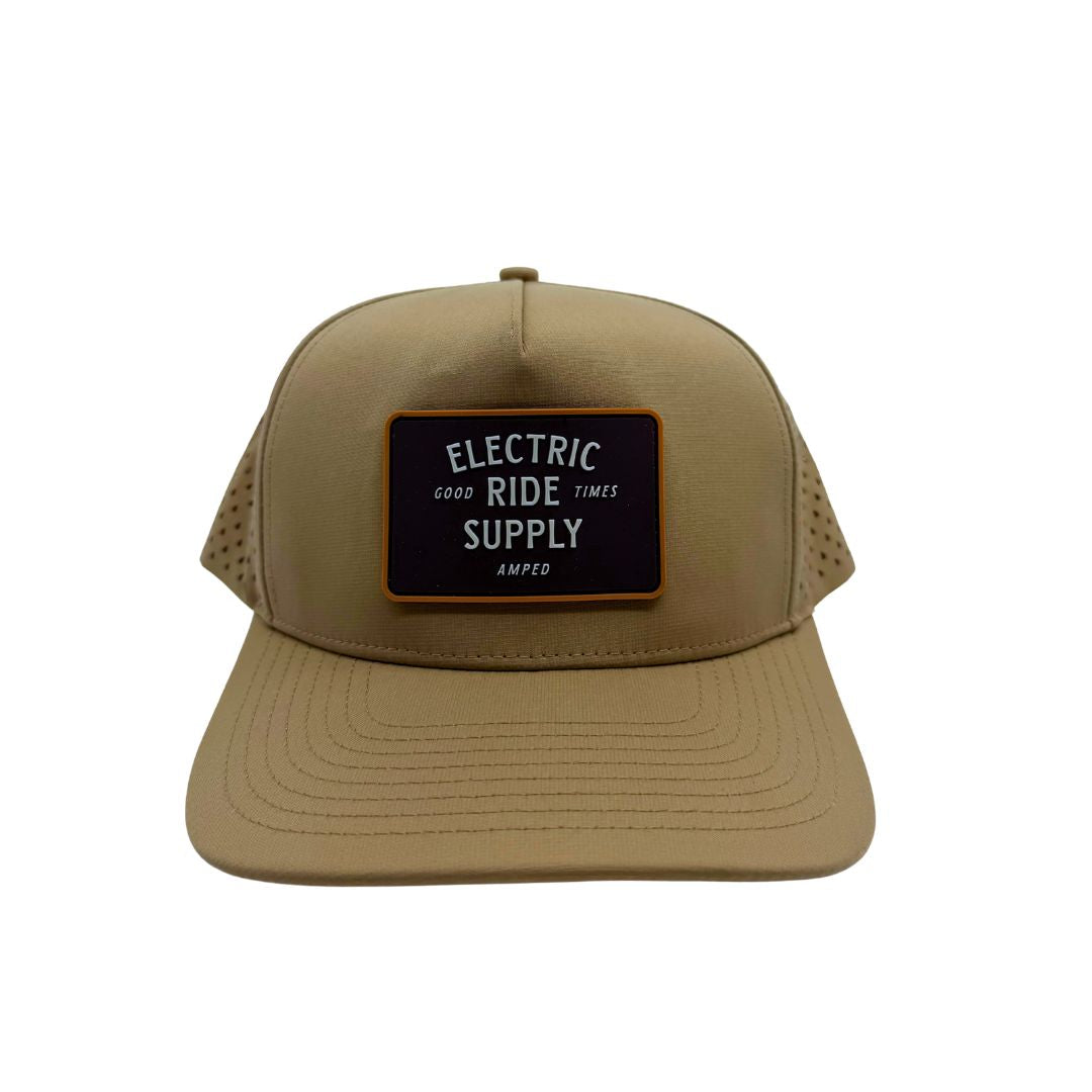 A khaki snapback hat with a black rectangular front patch that reads 'ELECTRIC RIDE SUPPLY'.
