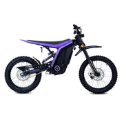 79Bike Lynx electric dirt bike in purple and black, side view showing the frame, rear coil-over suspension, chain drive, and knobby off-road tires.