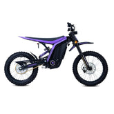 79Bike Lynx electric dirt bike in purple and black, side view showing the frame, rear coil-over suspension, chain drive, and knobby off-road tires.