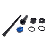 A set of Warp9s Stem Lock mechanical components is showcased on a white background, featuring a long rod resembling a steering tube, two cylindrical pieces, two circular rings, and a blue disk with SM letters.