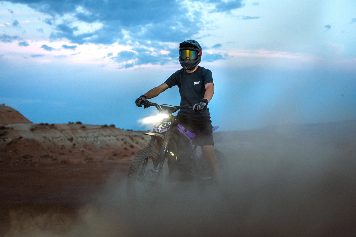 79Bike Lynx rider at dusk, headlight on through the dust