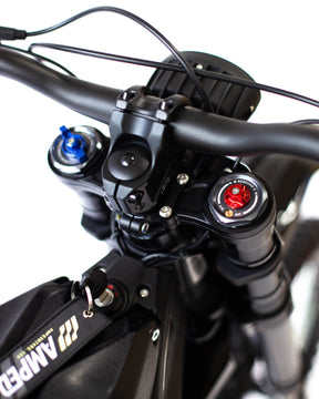 Closeup looking at the top of the front handlebars and ignition of the Sting R MX4